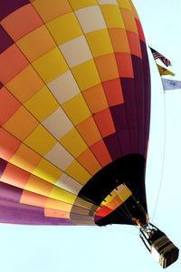 Low angle view of hot air balloon flying against sky