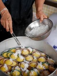 Midsection of man preparing food