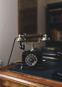 Close-up of telephone on table