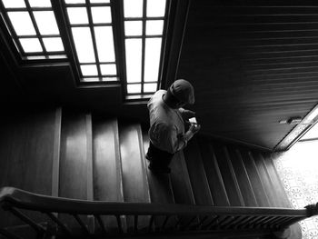 Man standing by railing