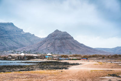 Scenic view of landscape and mountains against sky