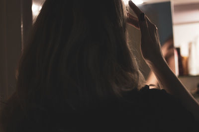 Close-up portrait of woman at home