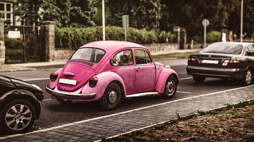 Red toy car on road