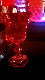 Close-up of red wine in glass on table