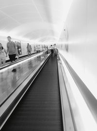 Man moving up on escalator