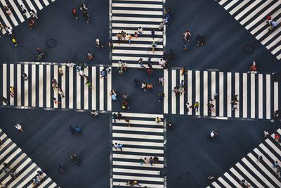 High angle view of people crossing the street