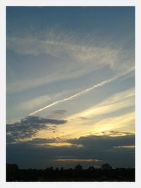 Scenic view of landscape against sky at sunset