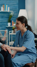 Nurse consoling patient in rehab center