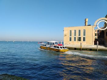 Nautical vessel on sea against clear sky