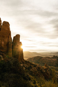 Sun flare on rock spires at the top of cathedral rock in sedona arizona