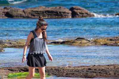 Full length of a man standing on beach
