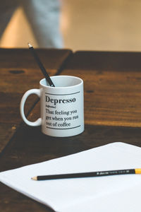 Close-up of coffee cup on table