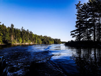 Scenic view of calm sea against clear sky