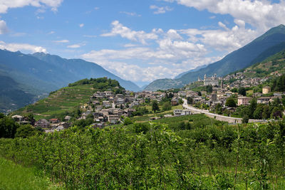 Panoramic view of buildings and mountains against sky