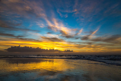 Scenic view of sea against sky at sunset