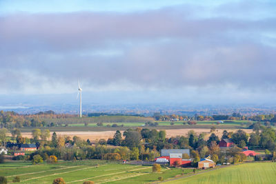 Rural landscape view with a wind turbine