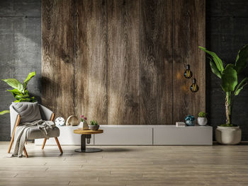 Portrait of woman sitting on hardwood floor