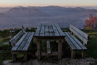 Scenic view of field and mountains against sky