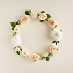 Directly above shot of roses on white table