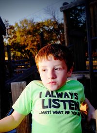 Close-up of boy on jungle gym at park