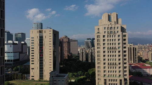 Buildings in city against sky