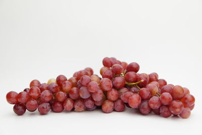 Close-up of grapes against white background