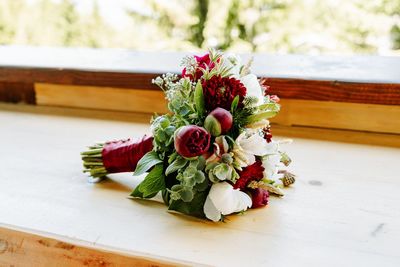 Close-up of rose and peony bouquet on table