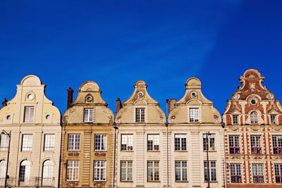 Low angle view of historical building against clear blue sky