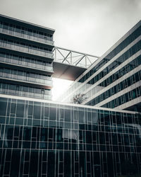 Low angle view of modern building against sky in city