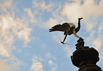 Low angle view of statue against sky