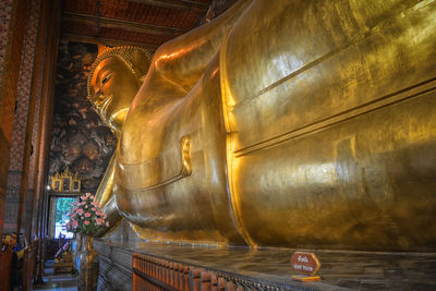 Statue of buddha outside building