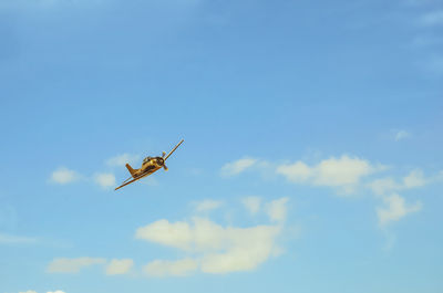 Low angle view of airplane flying in sky