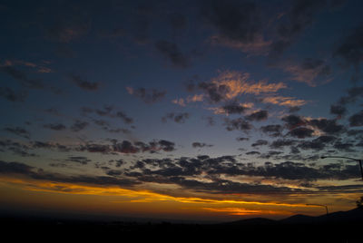 Low angle view of dramatic sky during sunset