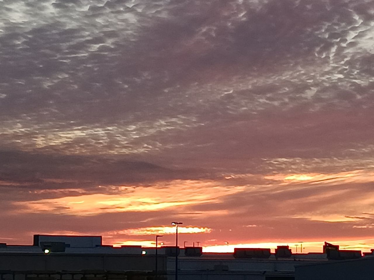 sky, cloud, sunset, architecture, afterglow, built structure, building exterior, dawn, dramatic sky, orange color, horizon, red sky at morning, nature, building, city, no people, beauty in nature, evening, outdoors, silhouette, cloudscape, sunlight, house, environment, scenics - nature, sun, residential district