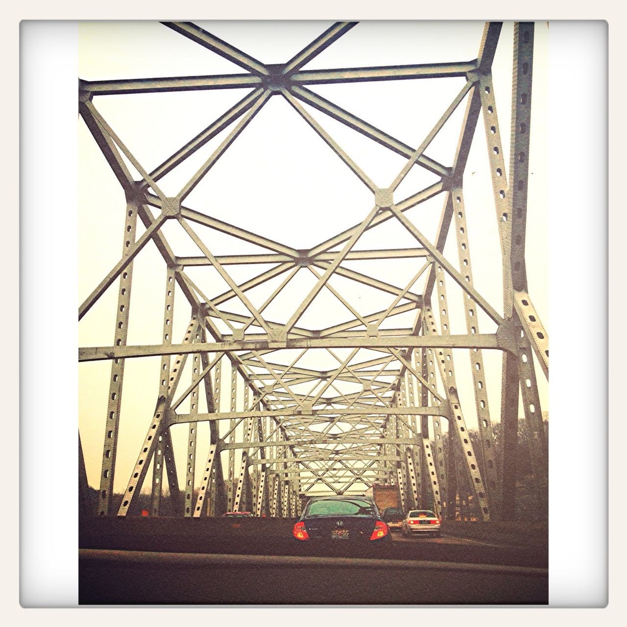 transfer print, built structure, architecture, auto post production filter, low angle view, connection, metal, transportation, sky, engineering, bridge - man made structure, day, metallic, building exterior, no people, outdoors, clear sky, diminishing perspective, bridge