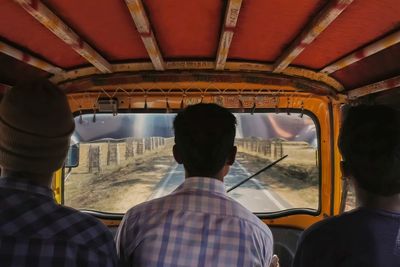 Rear view of people traveling in bus