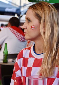 Woman with blond hair looking away