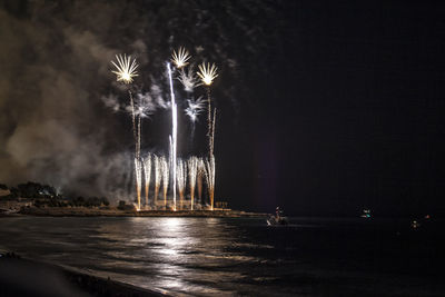 Firework display at night