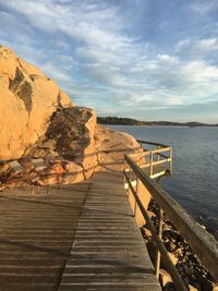 Pier amidst sea against sky