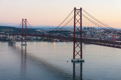 Red bridge april 25th in lisbon early morning. cityscape