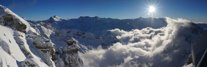 Low angle view of mountains against sky during winter