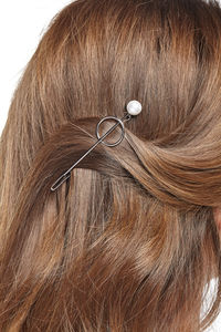 Close-up of woman with hairpin