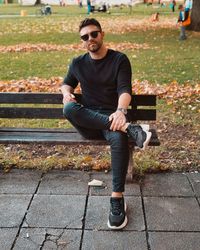 Portrait of young man sitting outdoors