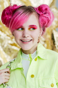 Close-up portrait of a smiling young woman