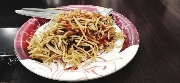 High angle view of noodles in plate on table