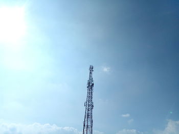 Low angle view of communications tower against sky