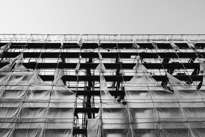 Low angle view of scaffolding against sky