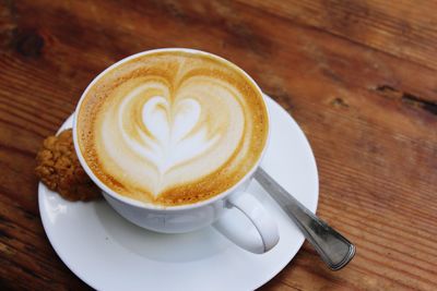 High angle view of cappuccino on table