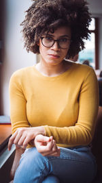 Portrait of young woman using smart phone