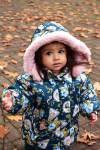 Close-up of cute girl at street